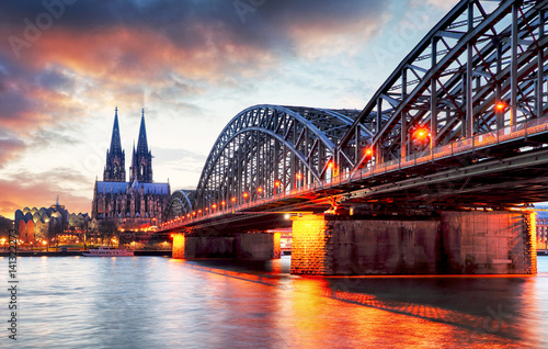 Cologne Cathedral and Hohenzollern Bridge at sunset - night