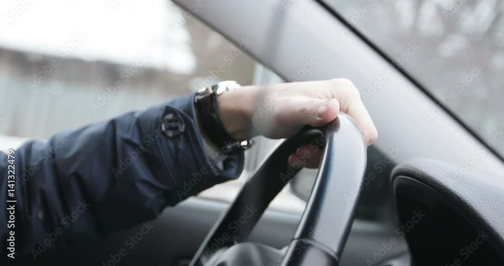 Close up of man's hands is on steering wheel. Close up of man's hands is on steering wheel.