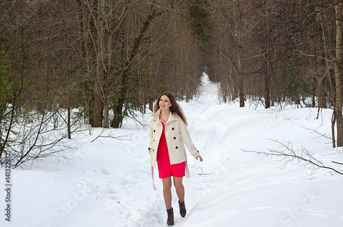 beautiful girl in dress and coat