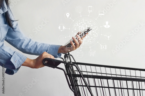 woman using mobile payments online shopping and icon customer network connection on screen, m-banking and omni channel photo