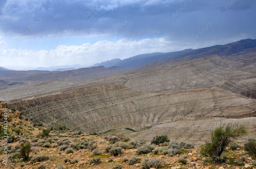 desert hilly terrain in the central part of Iran, storm clouds gather on the sky desert hilly terrain in the central part of Iran, storm clouds gather on the sky