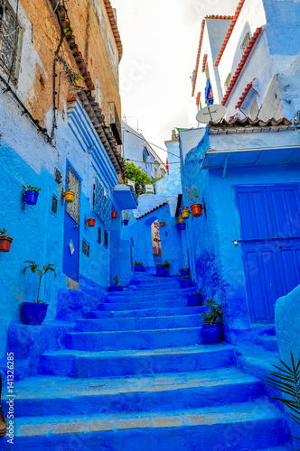 street in old Medina of the city of Shefshauen, Morokko. Bright saturated blue color © Tortuga