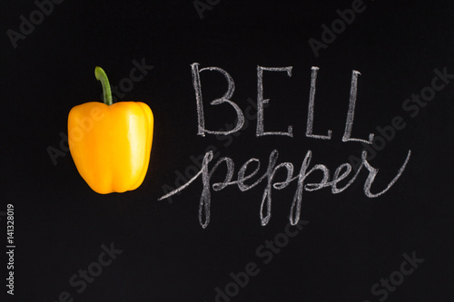 Fresh yellow pepper with the inscription