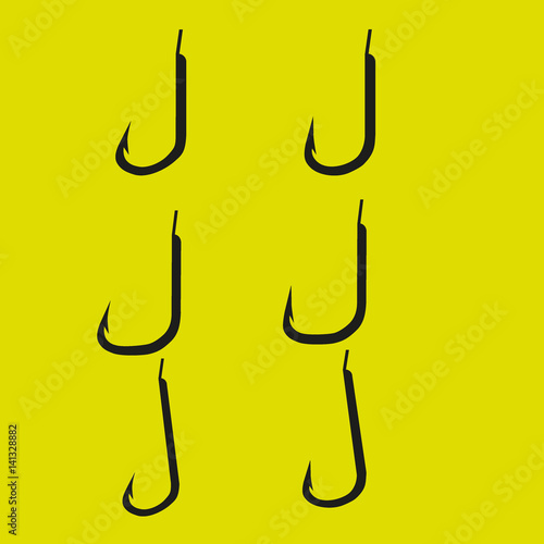 set of fishing hooks of different shapes on a yellow background