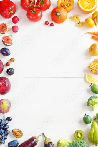 Rainbow colored fruits and vegetables on a white table. Juice and smoothie ingredients. Healthy eating   diet concept.