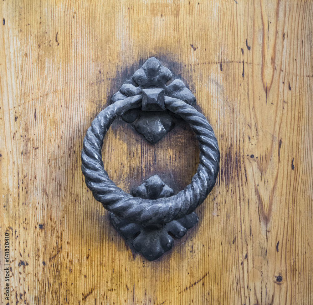 Details of an ancient Italian door in Florence, Italy. Details of an ancient Italian door in Florence, Italy.
