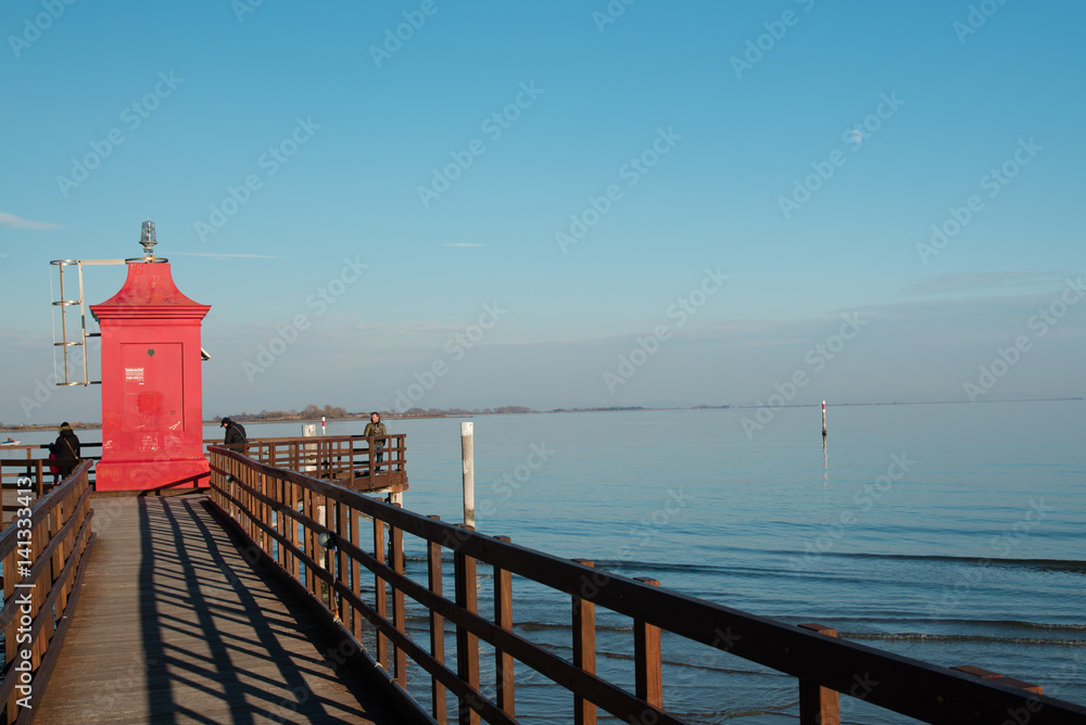 The old red lighthouse in Lignano Sabbiadoro The old red lighthouse in Lignano Sabbiadoro