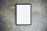 Mock up image of blank white picture frame on concrete polishing wall in loft style room