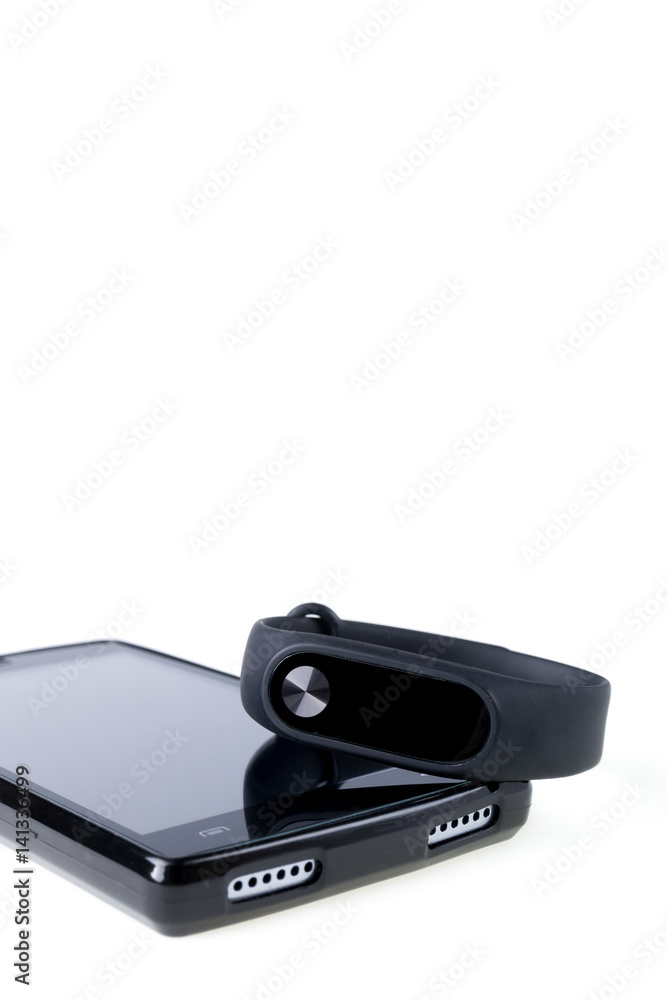 Fitness tracker and smartphone isolated on white background. Fitness tracker and smartphone isolated on white background.
