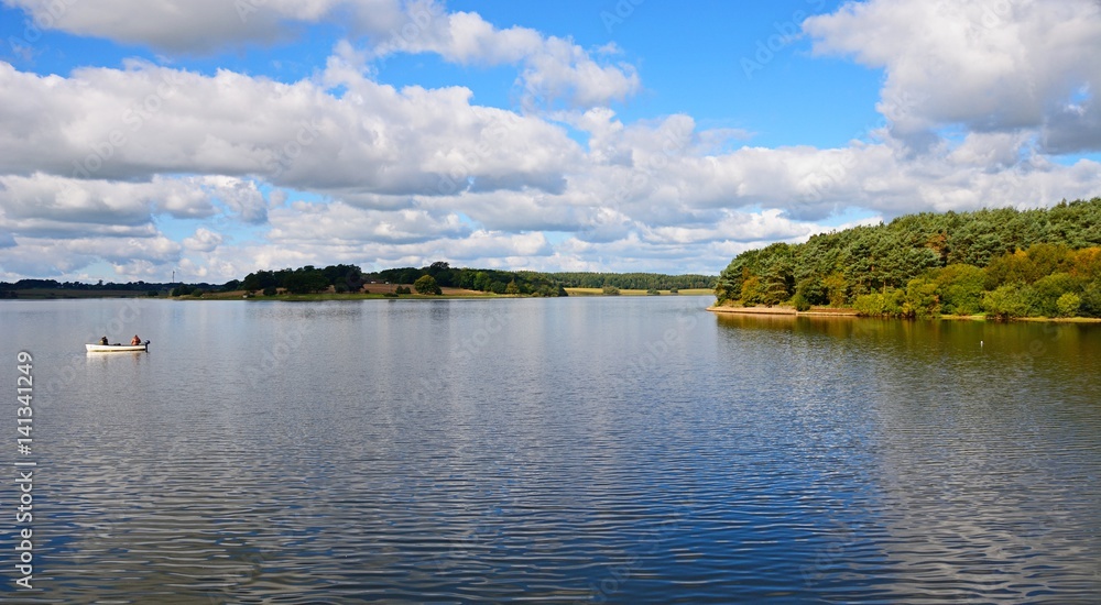 View across Blithfield reservoir with a small boat to the left hand side, Blithbury.