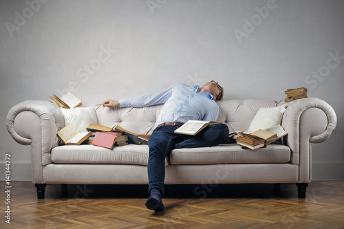 Tired man sleeping on the sofa