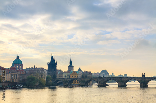 Morning view on Charles Bridge over Vltava river in Prague, Czech Republic.