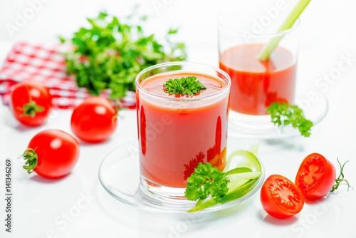 Wallpaper Mural tomato juice in transparent glasses with parsley, cutted tomato fruit, cucumber and red napkin, close up Torontodigital.ca