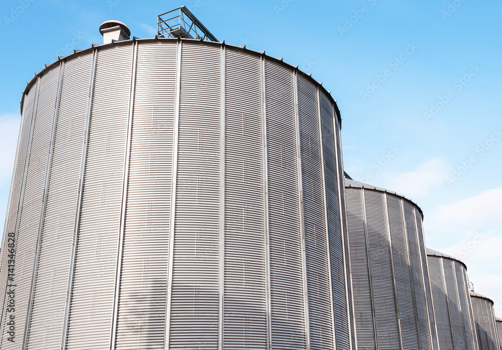 Agricultural silos on blue sky. Agricultural silos on blue sky.