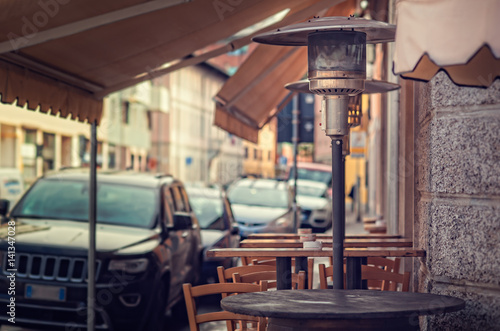 Gas heater, patio heater, mushroom heater. Tables for eating outdoors.