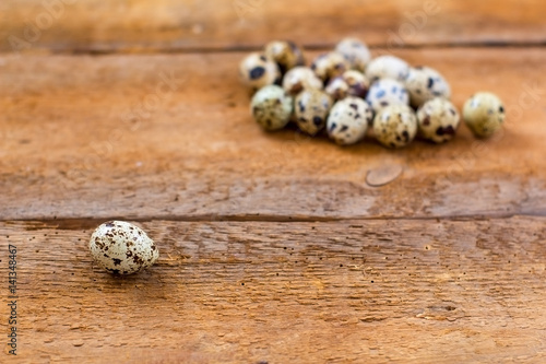 quail eggs on old brown wooden background