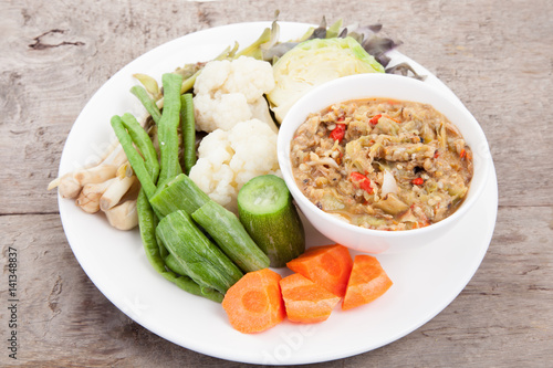 pimp chili paste or Chili paste Thai style with steamed and fresh vegetables