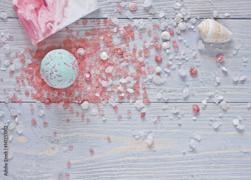 Spa background with bath bombs, aromatherapy salt,handmade soap bar and seashells.
