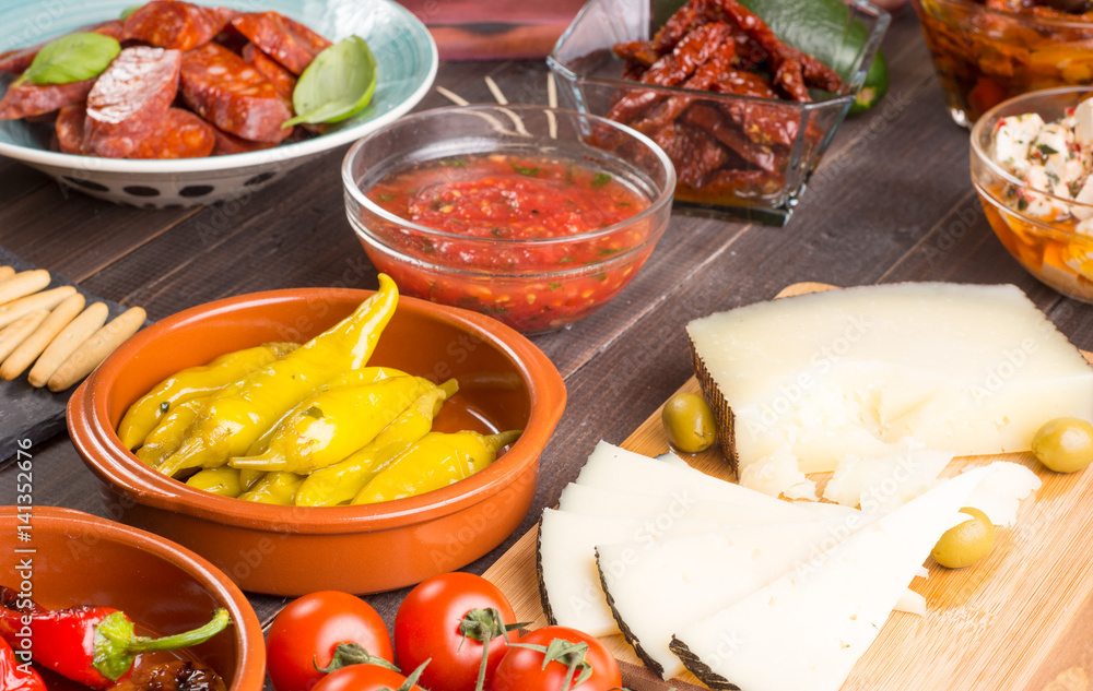 Spanish tapas appetizers on wooden table Spanish tapas appetizers on wooden table