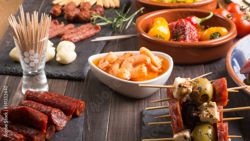 Spanish tapas appetizers on wooden table