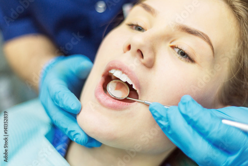 Close up view of open mouth during oral checkup at the dentist