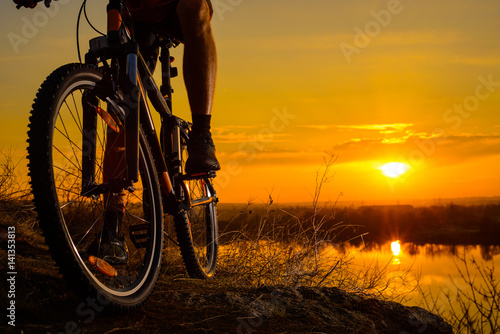 Wallpaper Mural Silhouette of Enduro Cyclist Riding the Mountain Bike on the Rocky Trail at Sunset. Active Lifestyle Concept. Space for Text. Torontodigital.ca