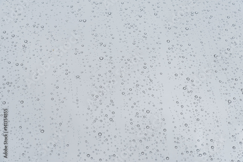 drops of water rain on window pane glass