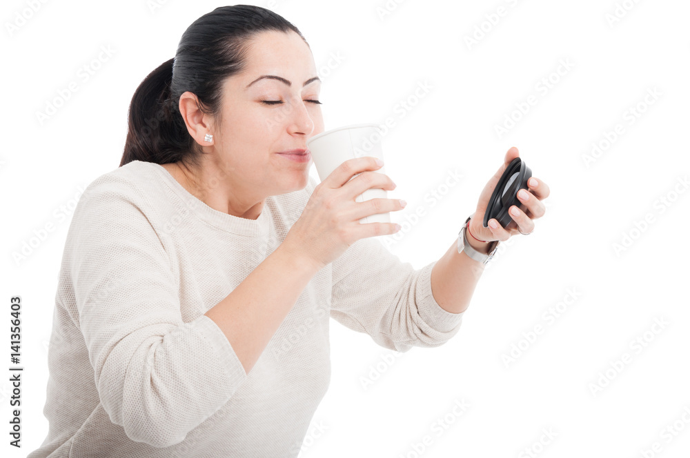 Happy female enjoying the smell of espresso Happy female enjoying the smell of espresso