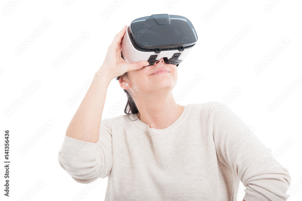Happy woman wearing a device to simulate reality Happy woman wearing a device to simulate reality
