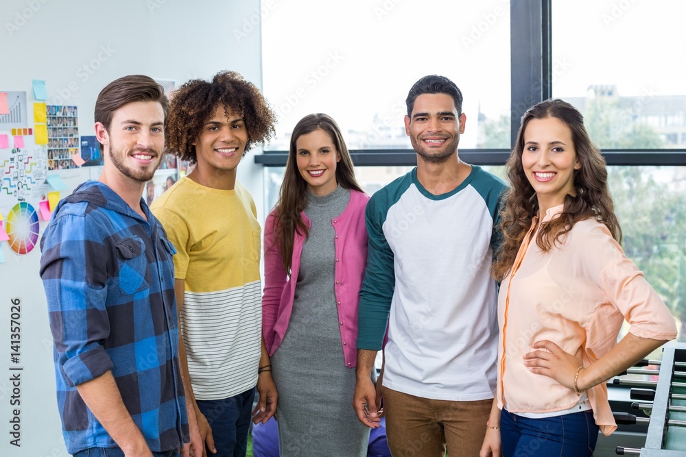 © WavebreakMediaMicro - Happy graphic designers standing together in office © WavebreakMediaMicro - Happy graphic designers standing together in office