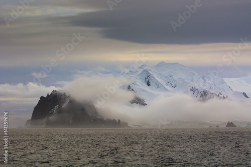 Mist over Greenwich Island, English strait, Antarctica photo