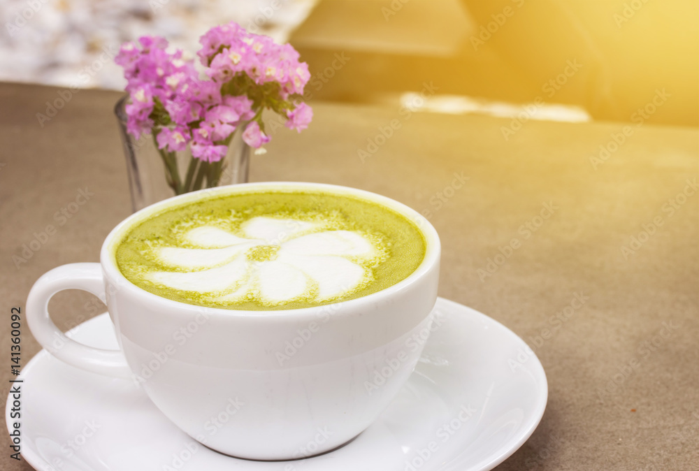 milk green tea on wooden floor and yellow tone milk green tea on wooden floor and yellow tone