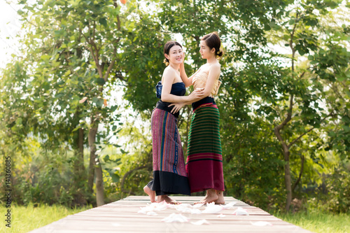 Lao women wear traditional dress at countryside.