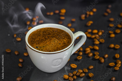 Cup of coffee on black background photo