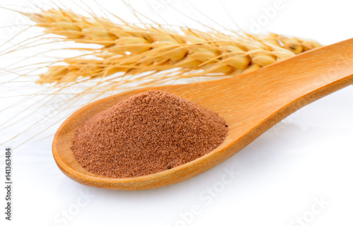 Photography malt extract in wood spoon on white background