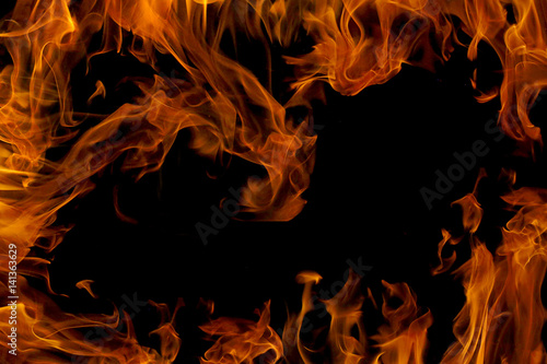 Fire flame isolated on black background. Fire frame with empty place for your design.