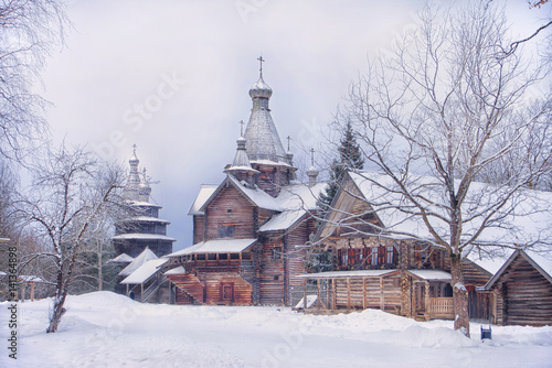 Ancient wooden church in winter and covered with snow, Vitoslavlitsy, Novgorod, Russia