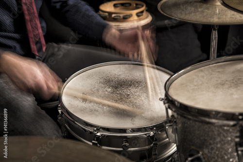 Drummer rolling on snare, closeup, motion blur