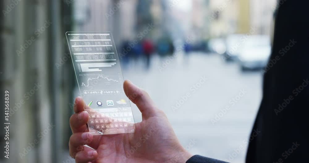 custom made wallpaper toronto digitalA businessman in the city, use the transparent phone with latest technology security code fingerprint. Concept: technology, business, security and internet banking, future