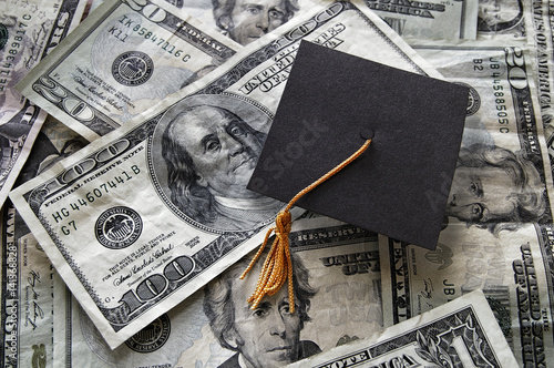 Graduation cap on assorted money photo