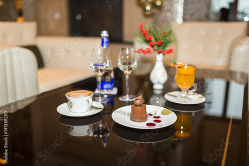 Drinks and desserts on table in cafe