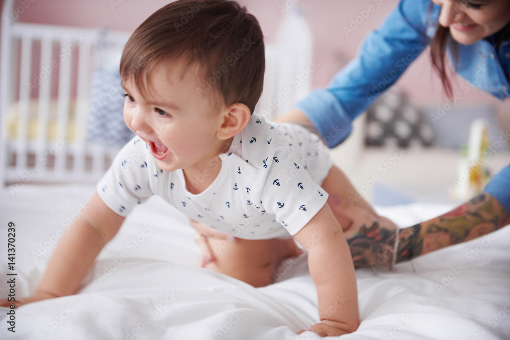 Fototapeta premium Sweet baby boy start crawling