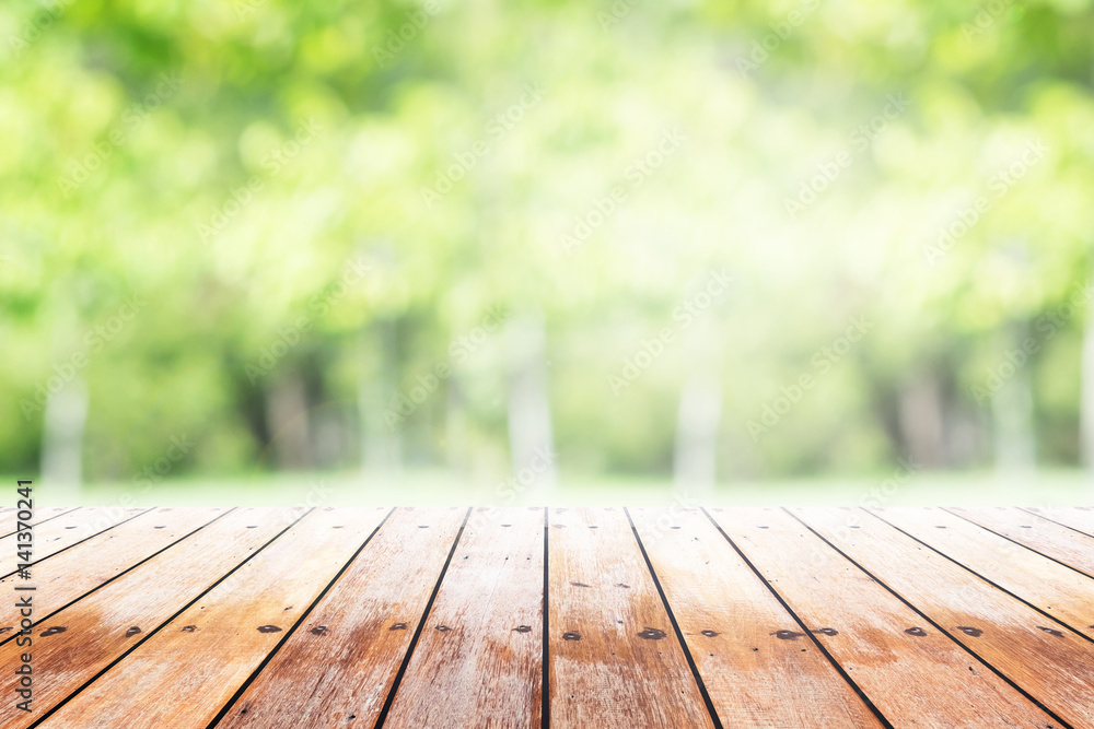 Empty wooden table with party in garden background blurred. Empty wooden table with party in garden background blurred.