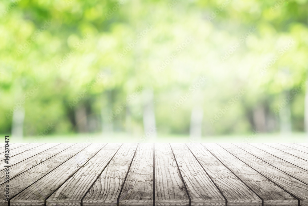 Empty wooden table with party in garden background blurred. Empty wooden table with party in garden background blurred.