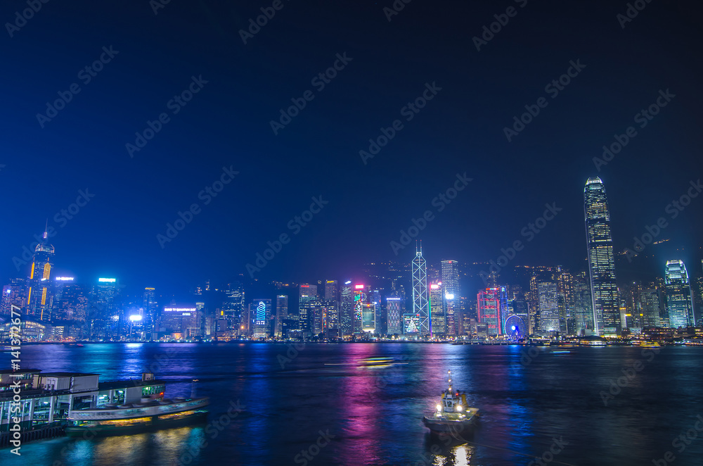 HONG KONG, CHINA - DEC 8, 2016: Hong Kong cityscape waterfront over Victoria harbor, to night on December 8, 2016 in Hong Kong, China