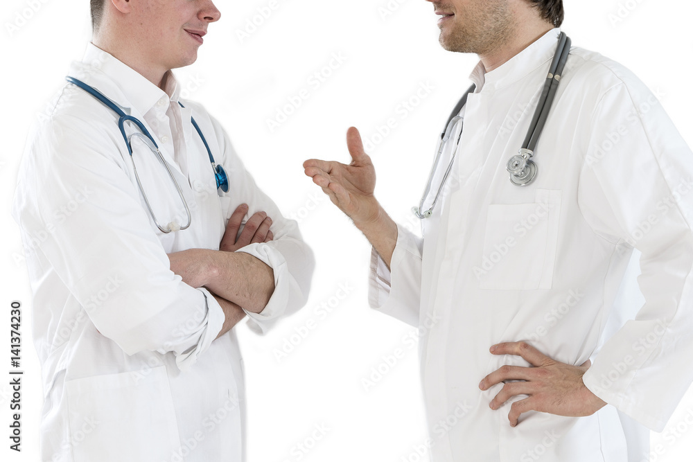 Two doctors men having conversation on a white background Two doctors men having conversation on a white background