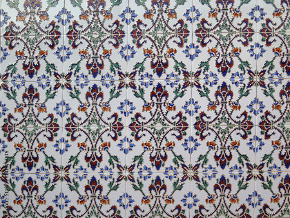 Wall tiled with blue floral ceramic tiles