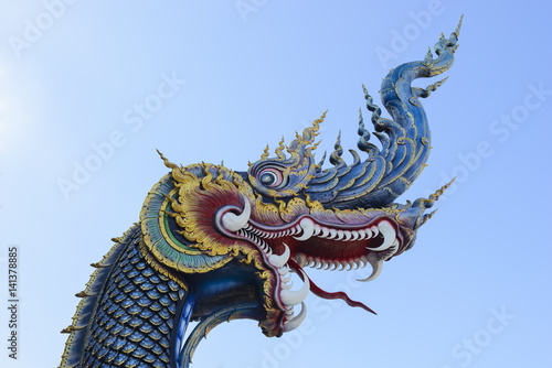 King of Naga in temple of Thailand with blue sky