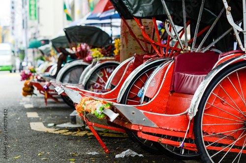 Vintage Trishaw stop beside road for service traveller
