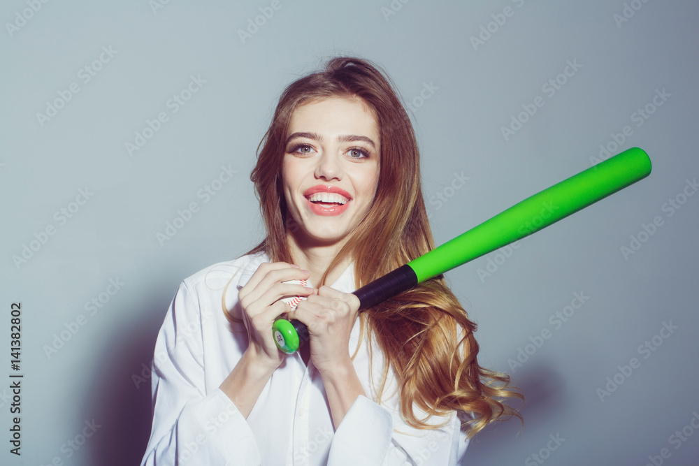 pretty sexy woman with long hair holds green baseball bat pretty sexy woman with long hair holds green baseball bat